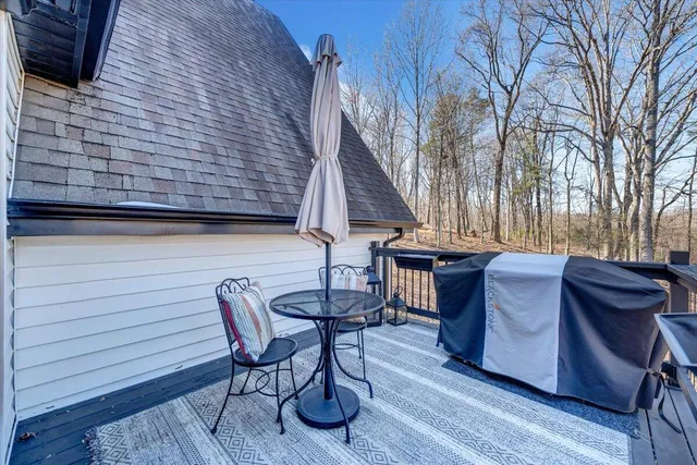 a view of a patio with table and chairs and potted plants