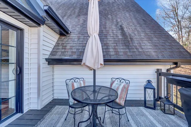 a view of a patio with couple of chairs