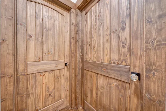 an aerial view of a houses with a yard and lake view