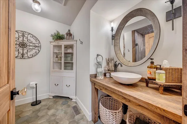 an aerial view of green landscape with trees houses and mountain view