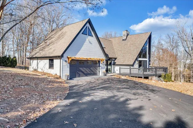 a view of house with yard and entertaining space