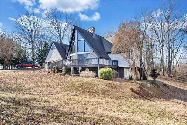 a spacious bedroom with a bed and a large window