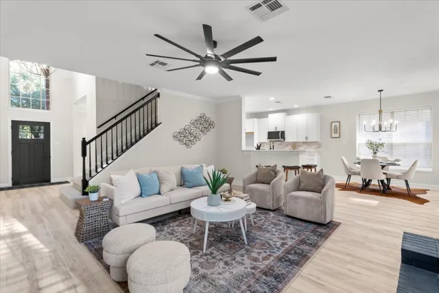 a living room with furniture and a large window