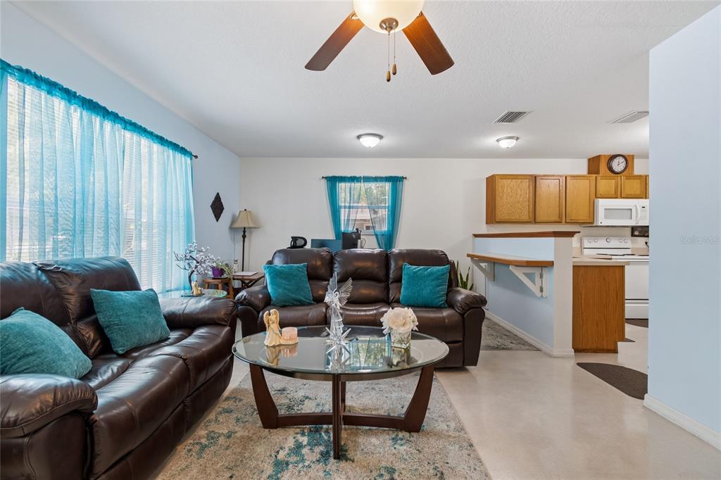 468 North Wheeler Avenue Inverness, FL 34453 - Photo 7 of 24 a living room with furniture and a large window