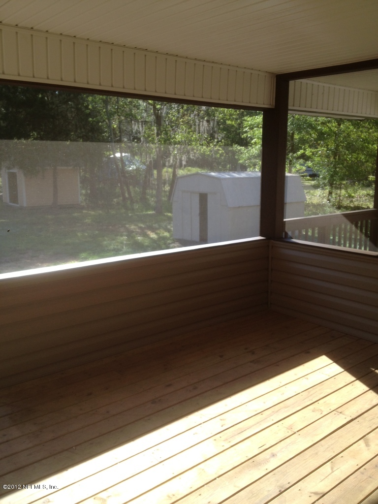 2753 Anniston Road Jacksonville, FL 32246 - Photo 31 of 37 Rear Covered Screened Porch