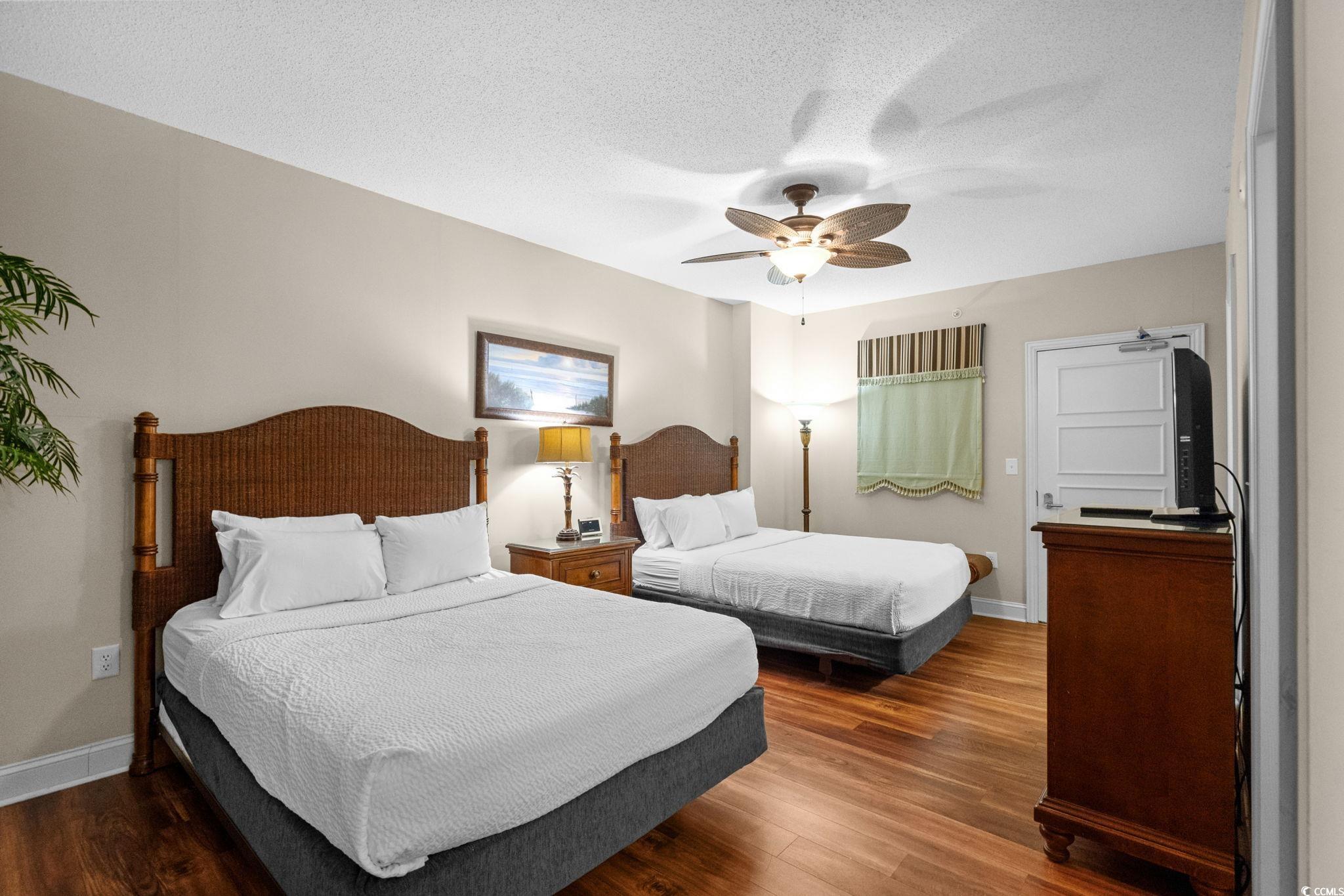 100 North Beach Boulevard, Unit 1803 North Myrtle Beach, SC 29582 - Photo 27 of 35 Bathroom with a chandelier, vanity, combined bath / shower with glass door, and light tile patterned flooring