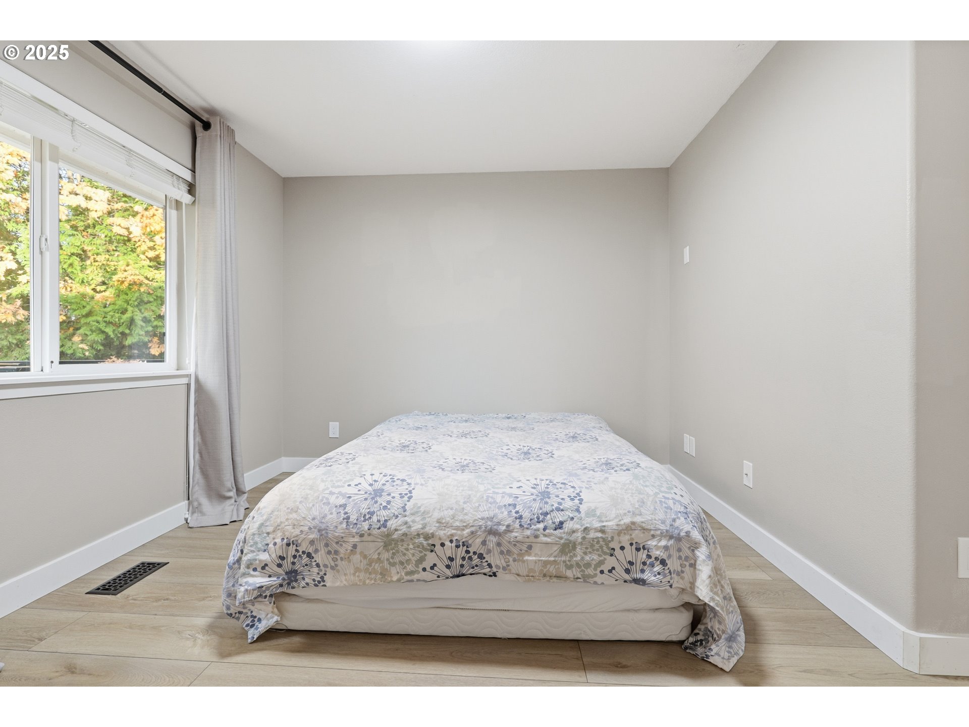 1533 Southwest 7th Circle Camas, WA 98607 - Photo 14 of 27 a bed sitting in a bedroom next to a window