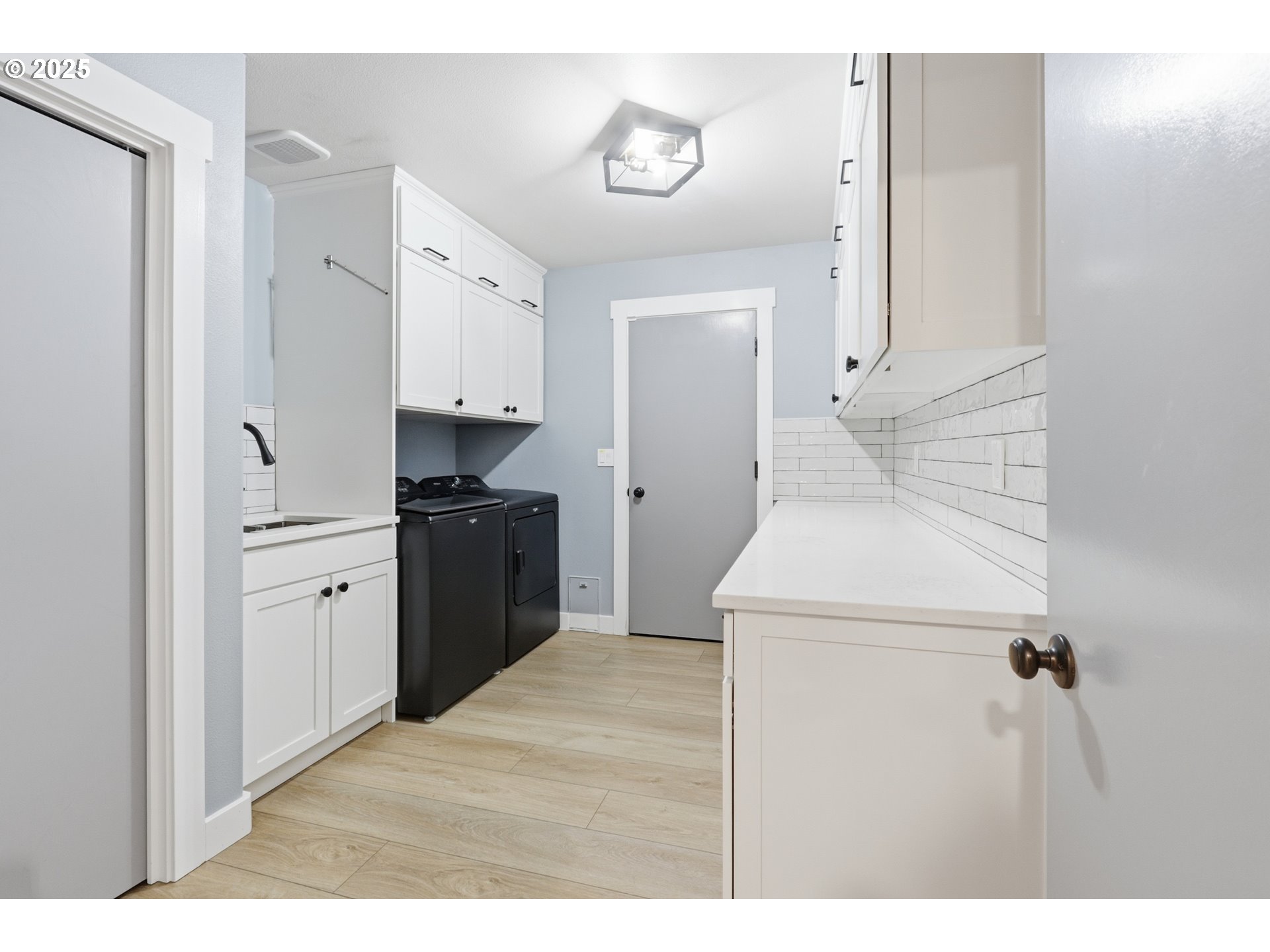 1533 Southwest 7th Circle Camas, WA 98607 - Photo 16 of 27 a kitchen with a refrigerator stove and white cabinets