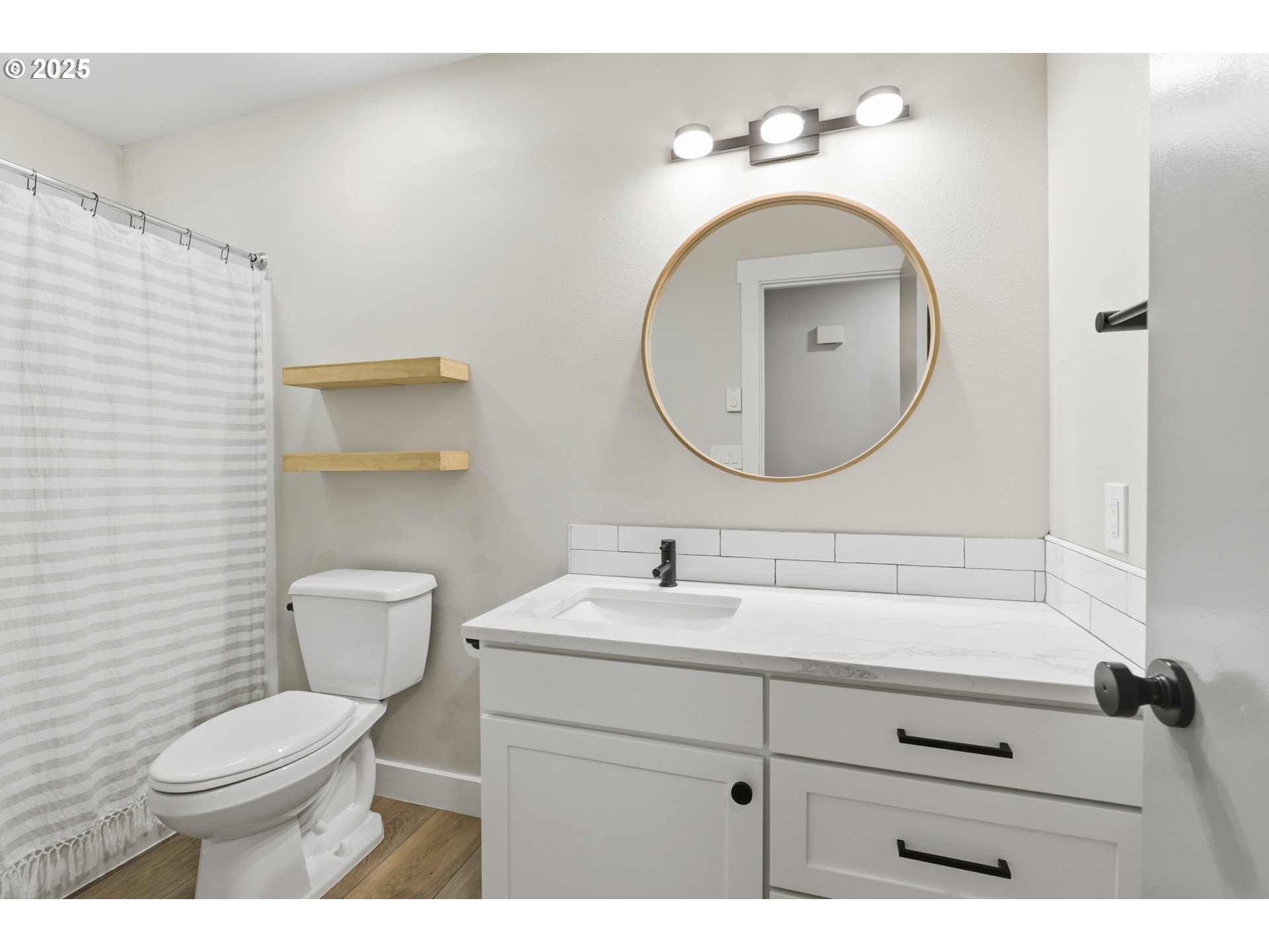 1533 Southwest 7th Circle Camas, WA 98607 - Photo 9 of 27 a bathroom with a toilet a sink and mirror