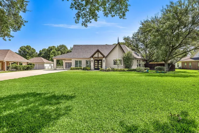 a front view of house with yard and green space