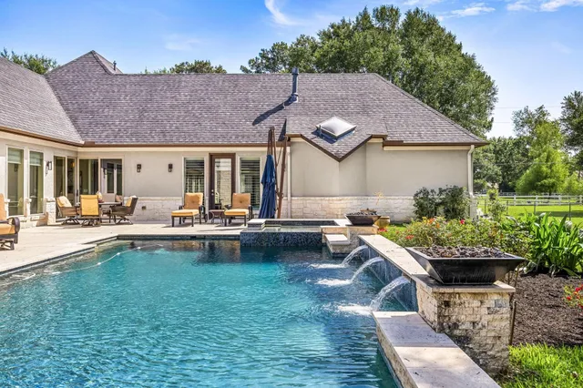 a front view of house with yard patio and outdoor seating