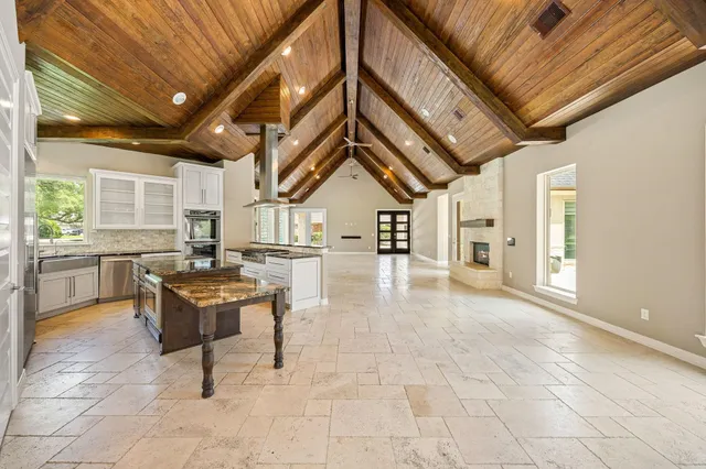a lobby with furniture and a rug