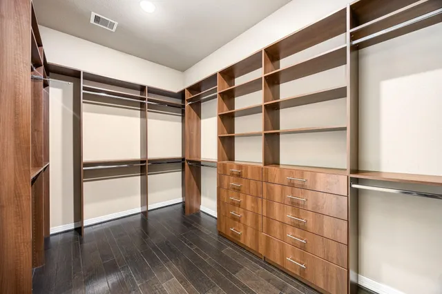 a wooden shelves and closet in room