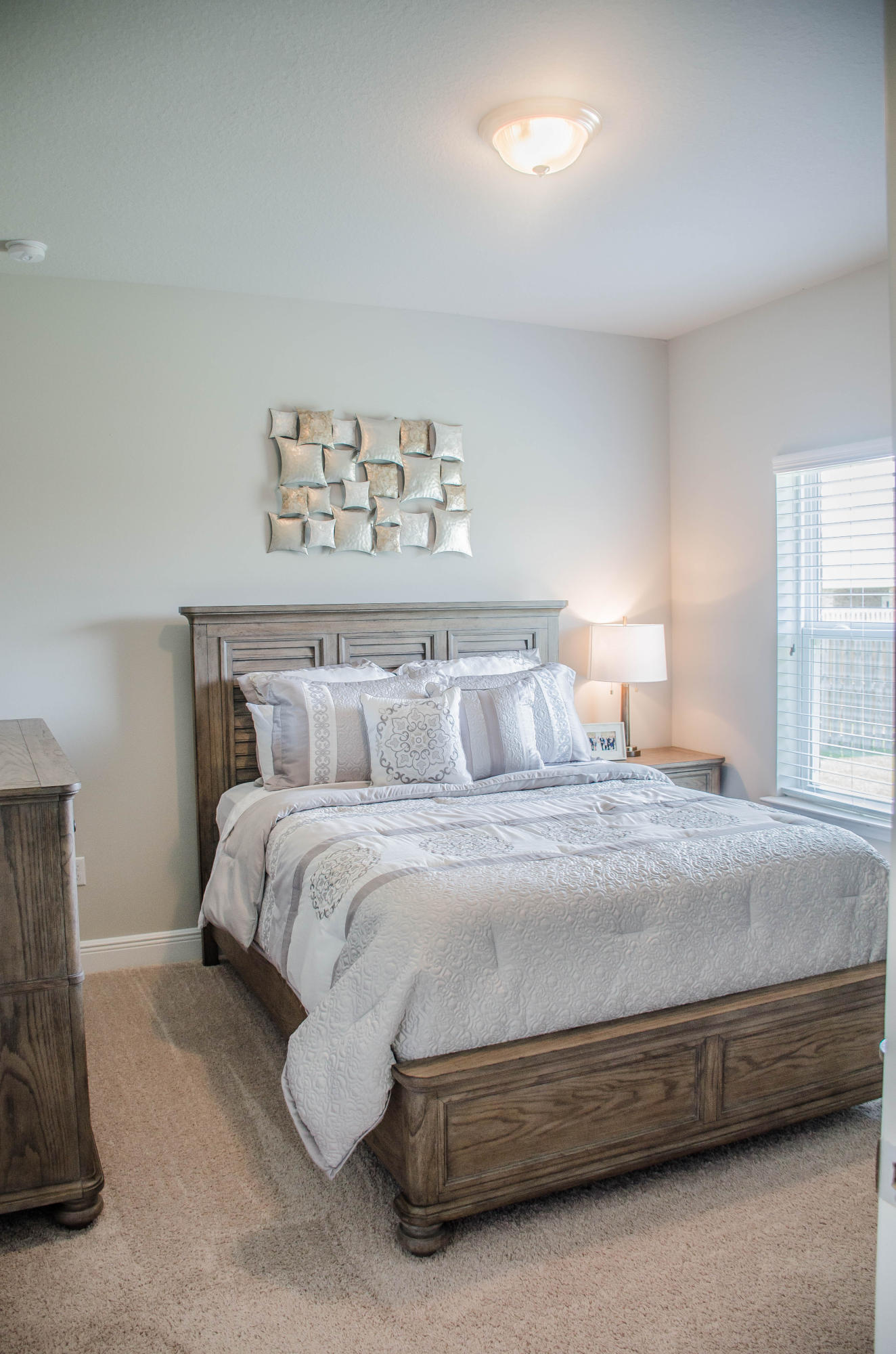 513 Gadwell Street Crestview, FL 32539 - Photo 31 of 49 a spacious bedroom with a bed and window