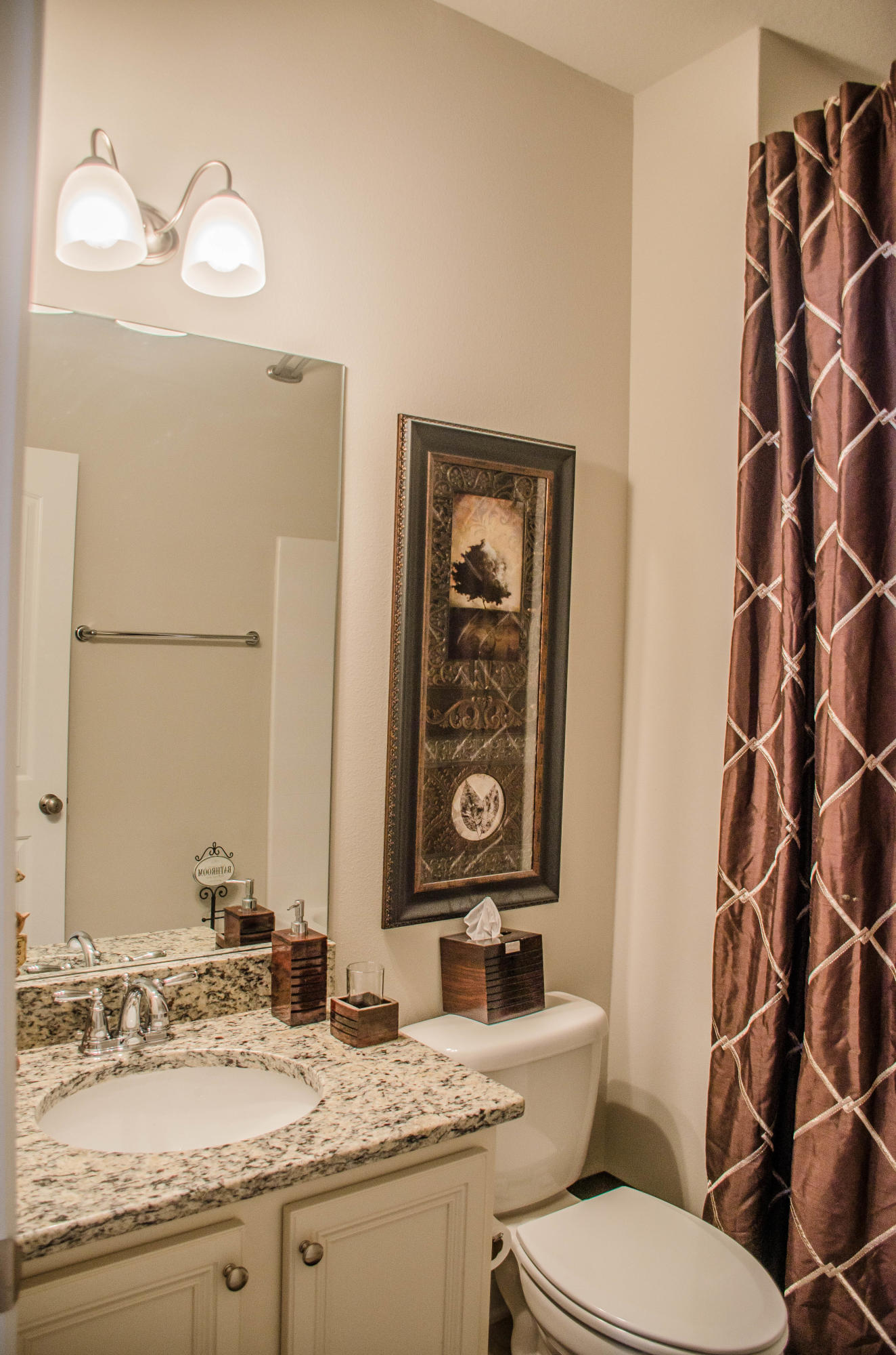 513 Gadwell Street Crestview, FL 32539 - Photo 39 of 49 a bathroom with a granite countertop toilet sink and mirror