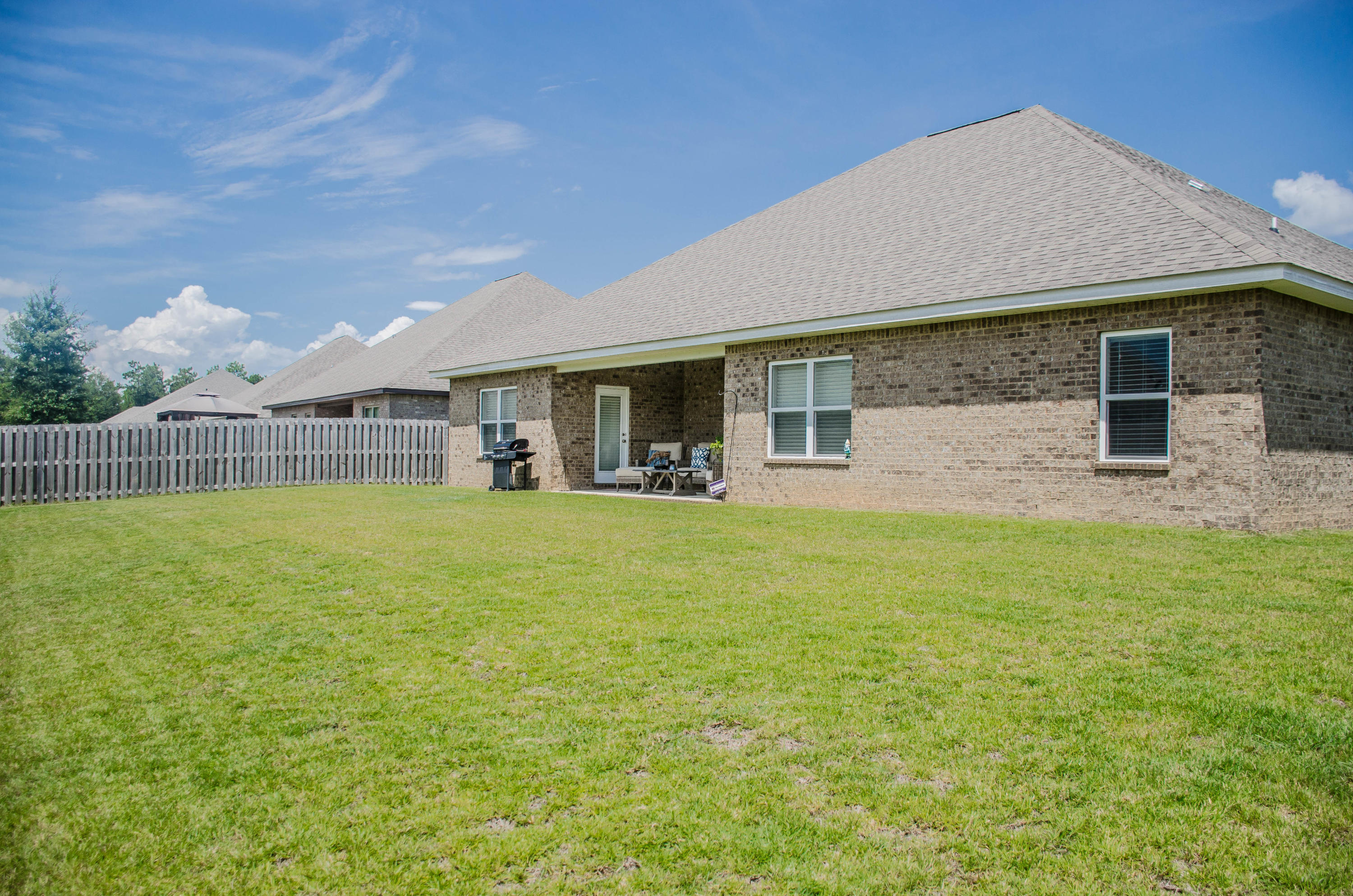 513 Gadwell Street Crestview, FL 32539 - Photo 43 of 49 a front view of house with yard and seating area