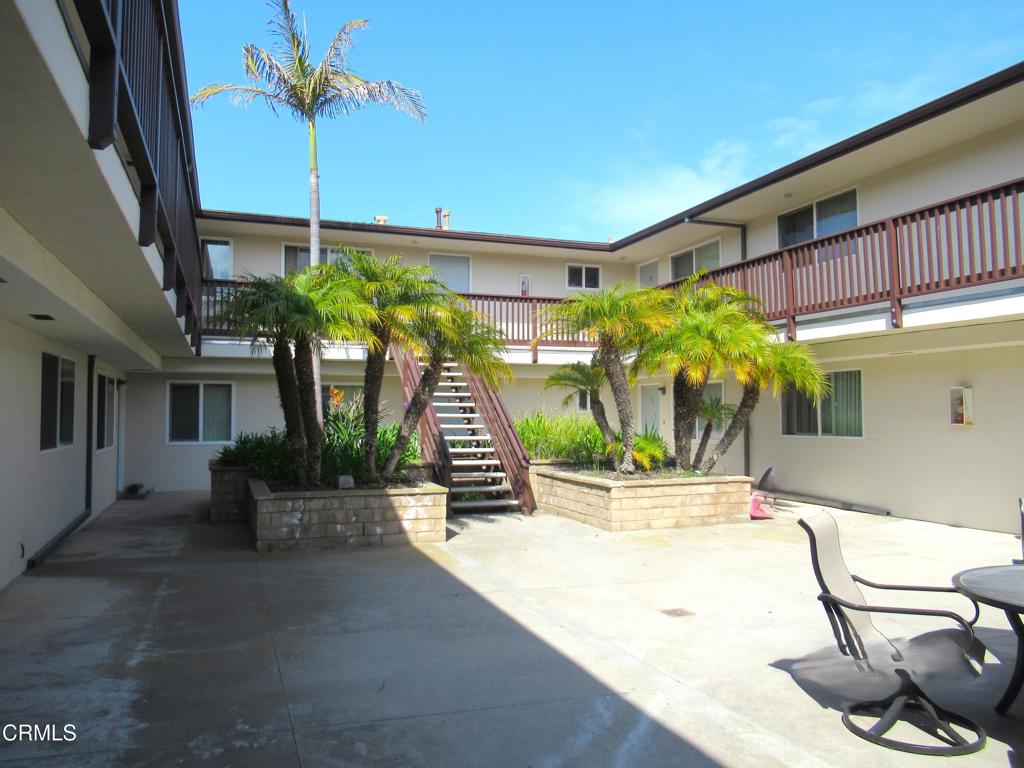 5009 Nautilus Street, Unit 14 Oxnard, CA 93035 - Photo 11 of 11 a view of a patio with plants and table and chairs