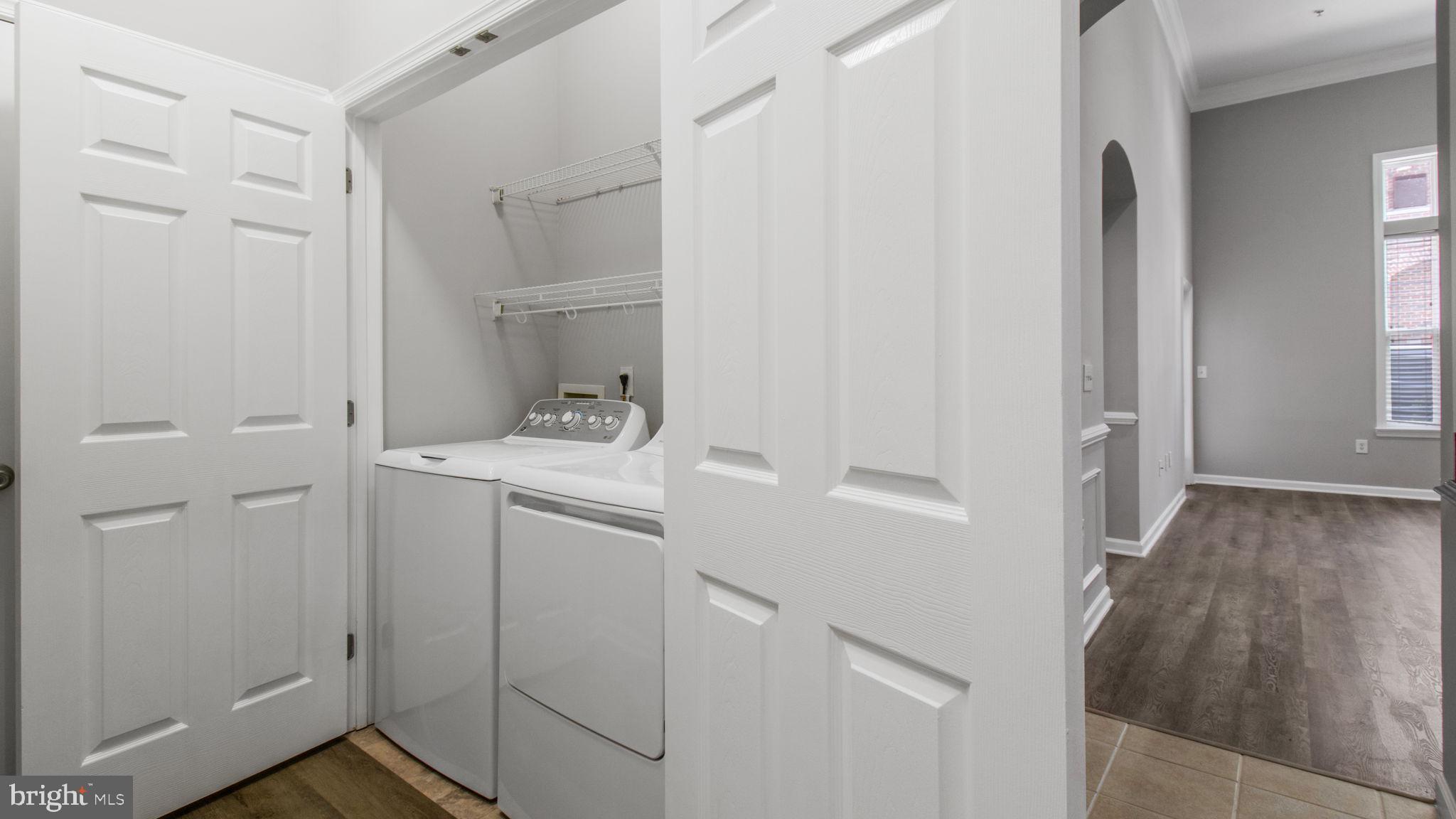 3 Arch Place, Unit 130 Gaithersburg, MD 20878 - Photo 16 of 45 a bathroom with a sink and mirror