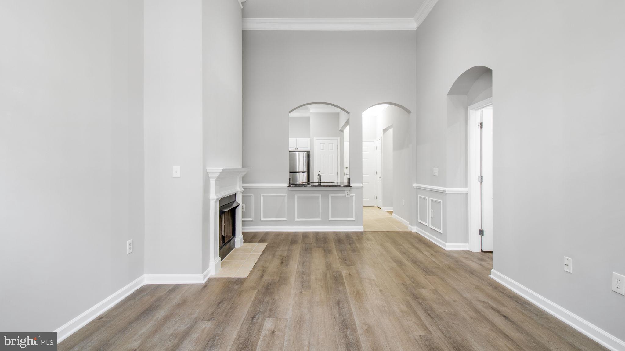 3 Arch Place, Unit 130 Gaithersburg, MD 20878 - Photo 2 of 45 a view of a room with wooden floor