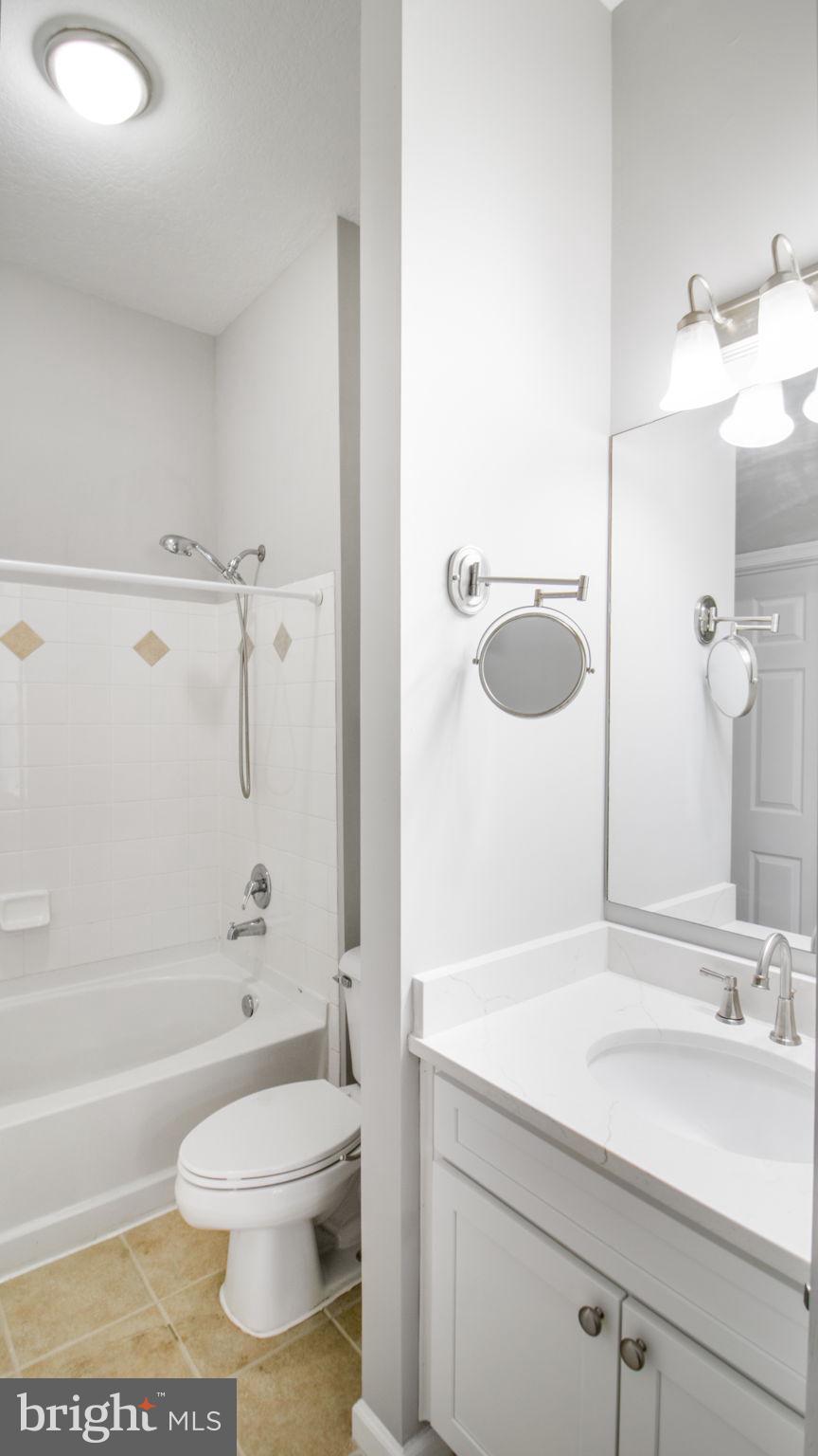 3 Arch Place, Unit 130 Gaithersburg, MD 20878 - Photo 26 of 45 a bathroom with a sink a toilet and shower