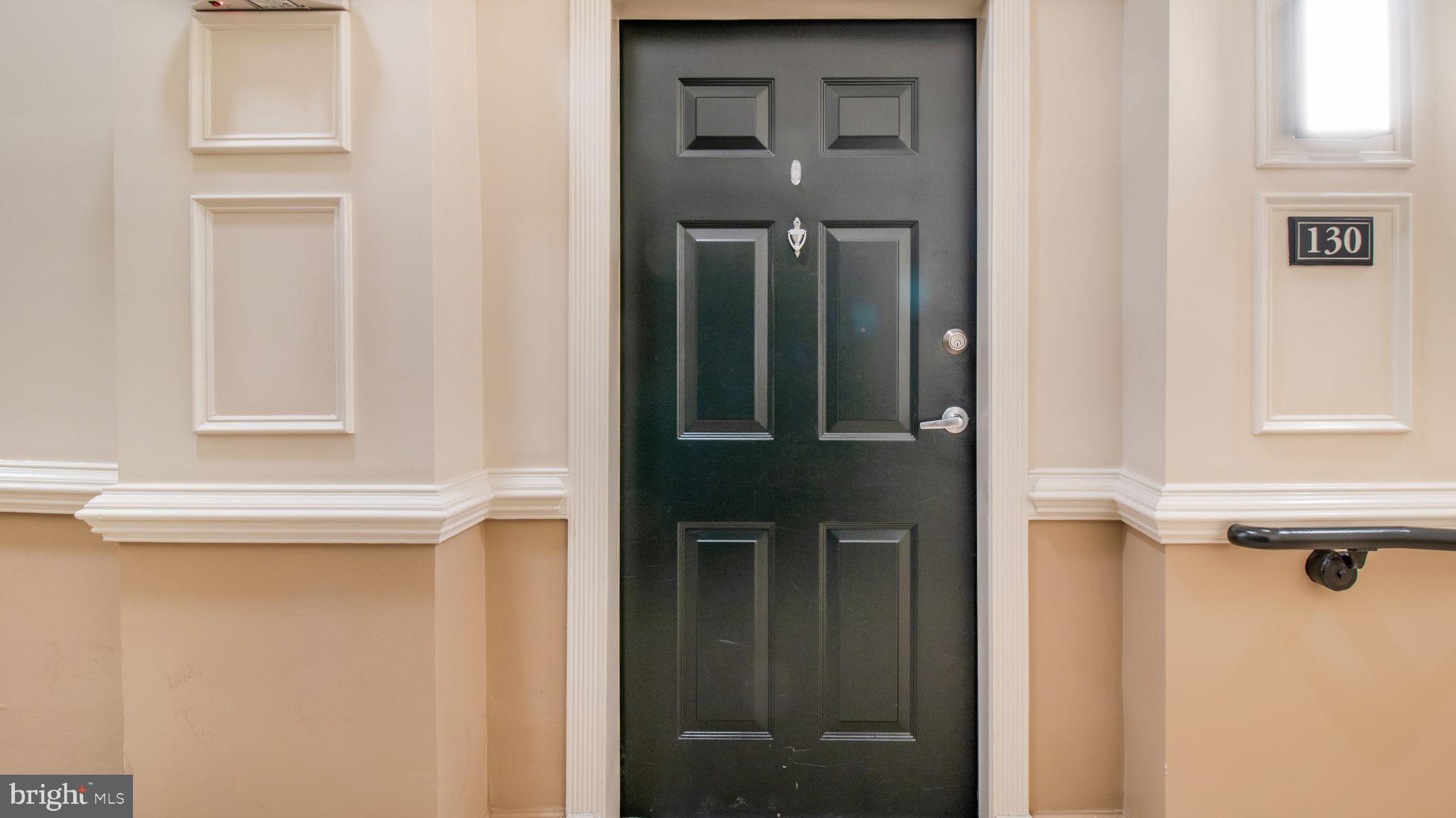 3 Arch Place, Unit 130 Gaithersburg, MD 20878 - Photo 29 of 45 a view of a door and a window