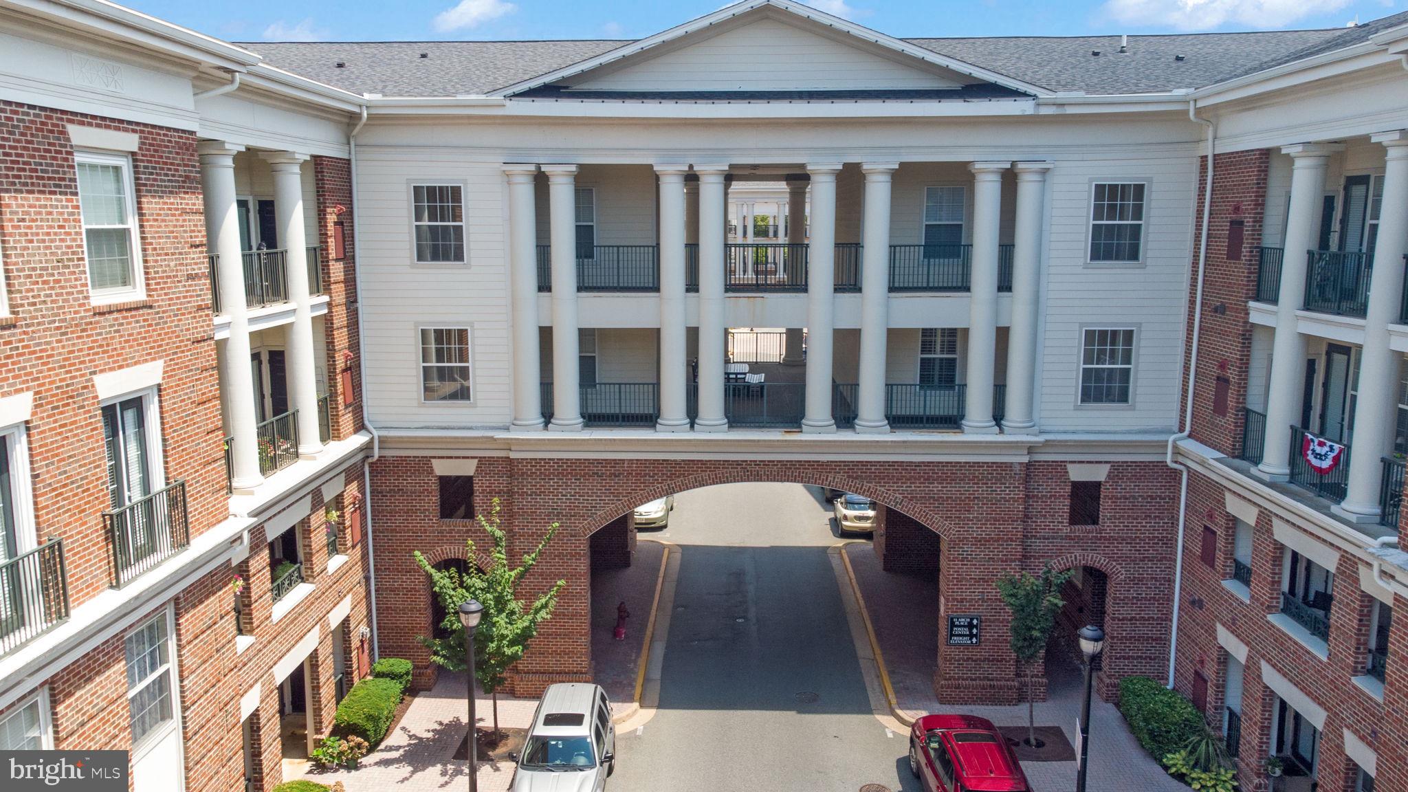 3 Arch Place, Unit 130 Gaithersburg, MD 20878 - Photo 33 of 45 a front view of a building with glass windows