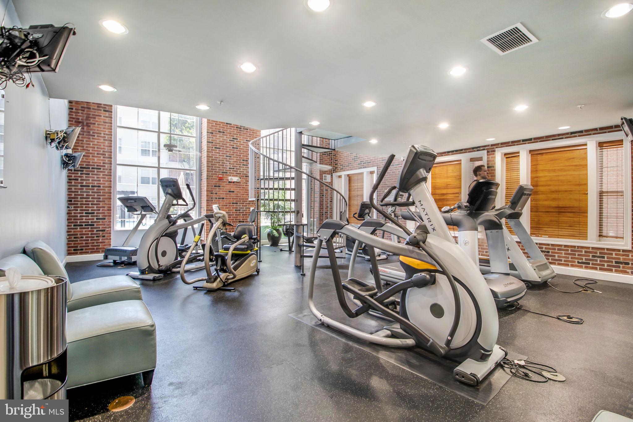 3 Arch Place, Unit 130 Gaithersburg, MD 20878 - Photo 37 of 45 a view of a room with gym equipment