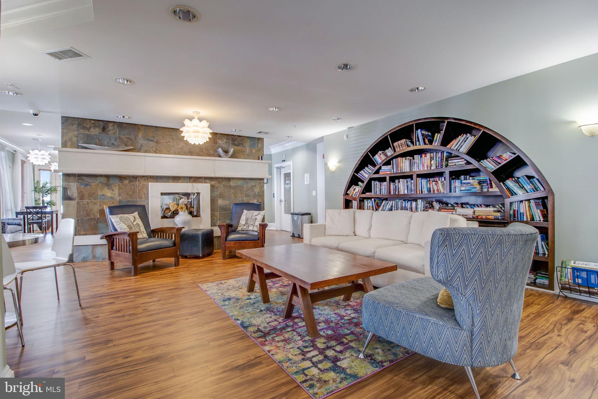 3 Arch Place, Unit 130 Gaithersburg, MD 20878 - Photo 40 of 45 a living room with furniture and a wooden floor