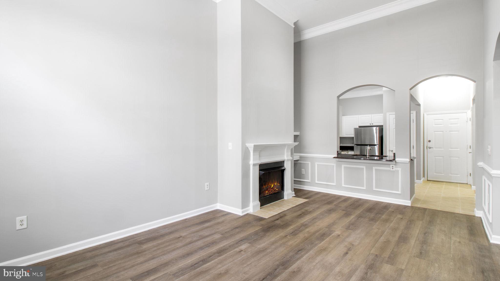 3 Arch Place, Unit 130 Gaithersburg, MD 20878 - Photo 4 of 45 a view of a kitchen with a sink and a stove top oven