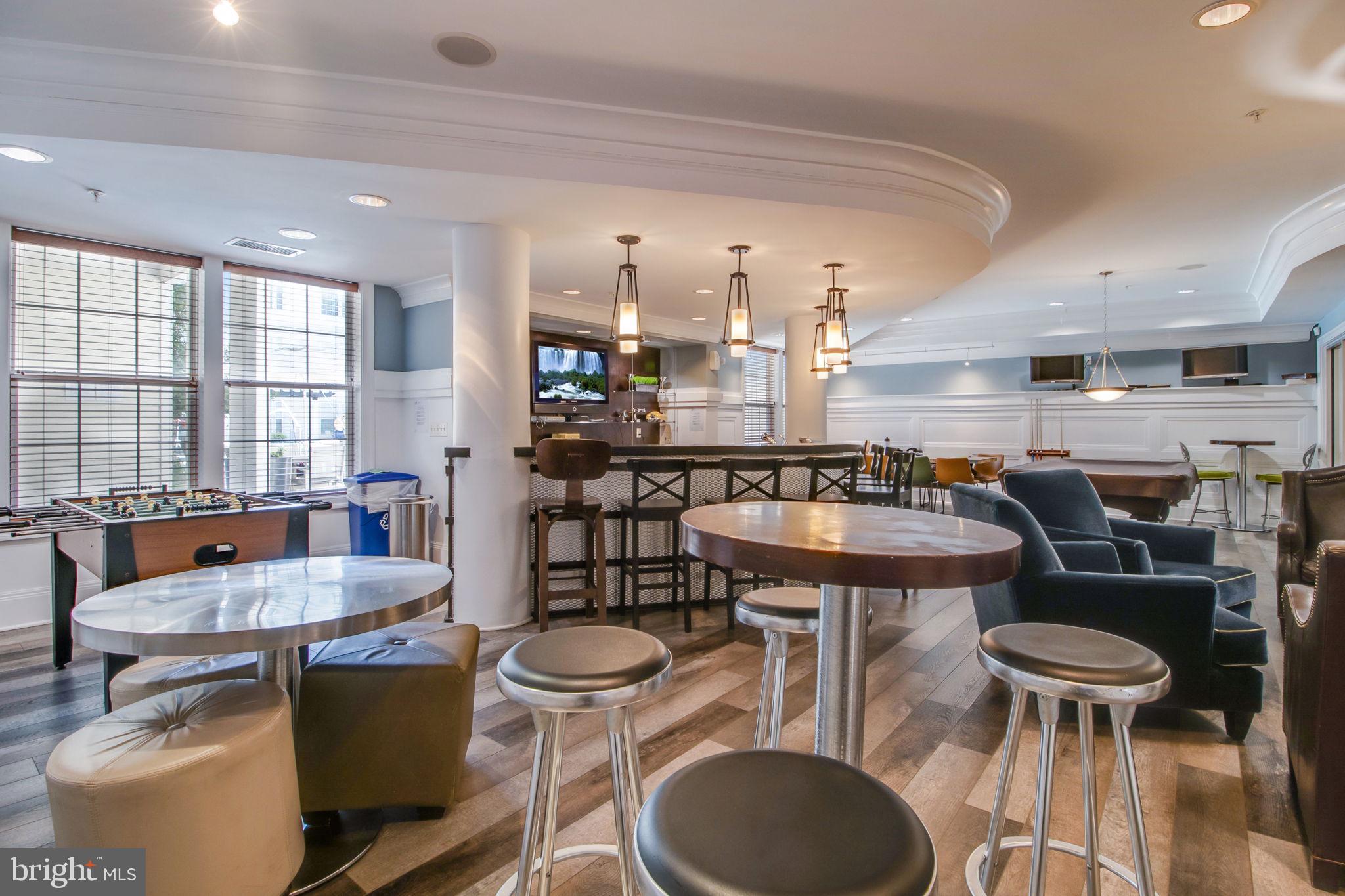 3 Arch Place, Unit 130 Gaithersburg, MD 20878 - Photo 41 of 45 a kitchen with a table and chairs