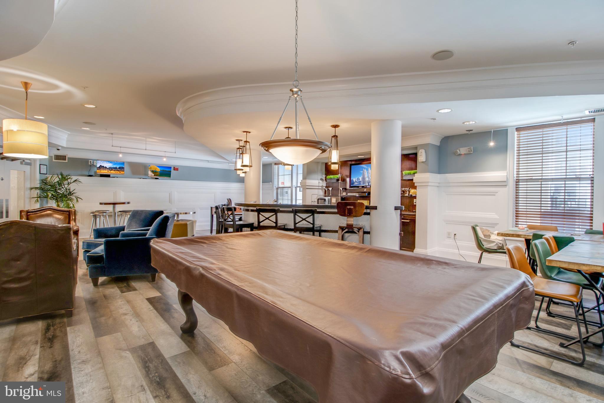 3 Arch Place, Unit 130 Gaithersburg, MD 20878 - Photo 44 of 45 a large kitchen with a table and chairs