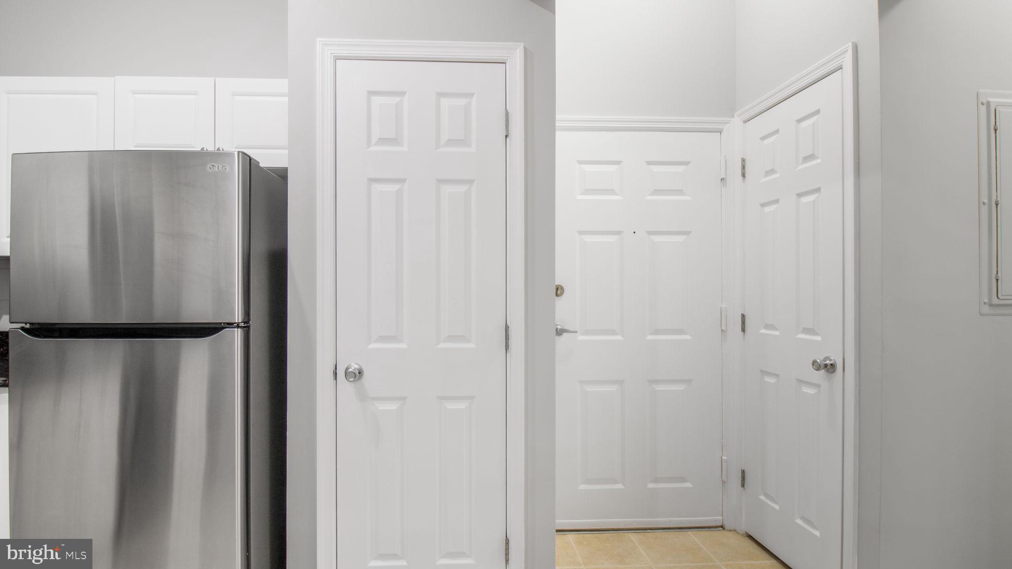3 Arch Place, Unit 130 Gaithersburg, MD 20878 - Photo 9 of 45 a bathroom with a shower and a glass door