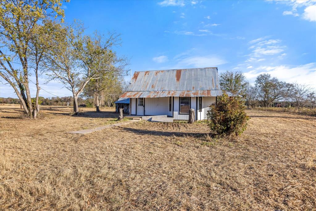 733 Baker Street Dublin, TX 76446 - Photo 2 of 8 a view of a house with a yard