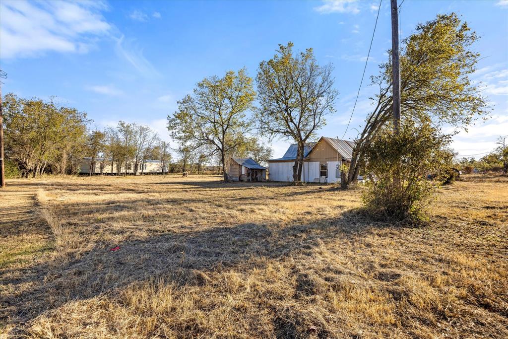 733 Baker Street Dublin, TX 76446 - Photo 4 of 8 a front view of a house with a yard