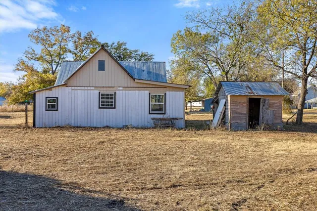 a house with trees in the background