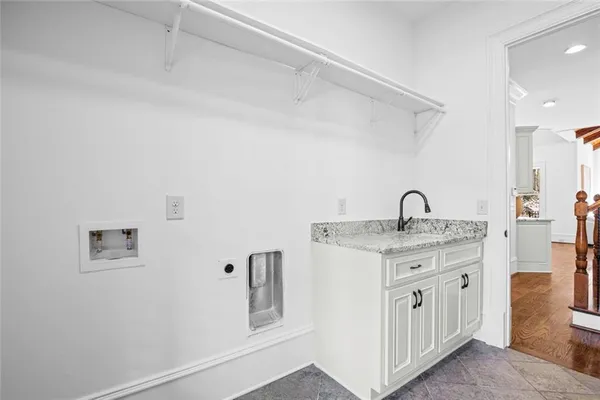 a view of a dining room with furniture wooden floor and a chandelier