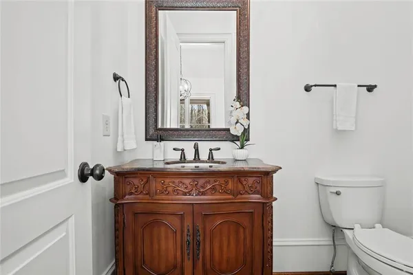 a bathroom with a granite countertop bathtub shower sink and mirror