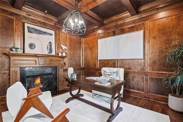 a kitchen with stainless steel appliances granite countertop a kitchen island a stove a table and chairs in it
