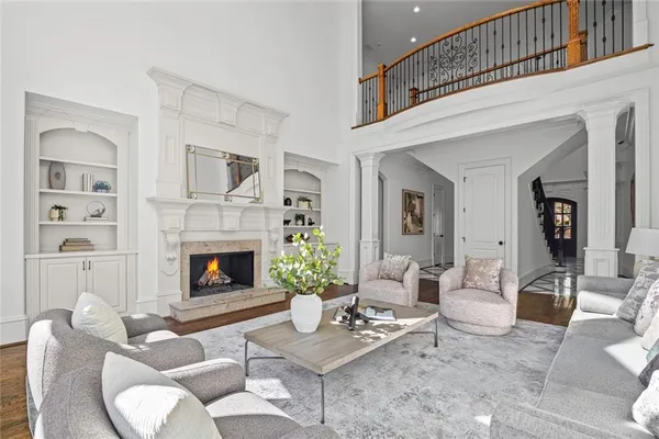 a kitchen with stainless steel appliances granite countertop a sink a stove and a wooden floors