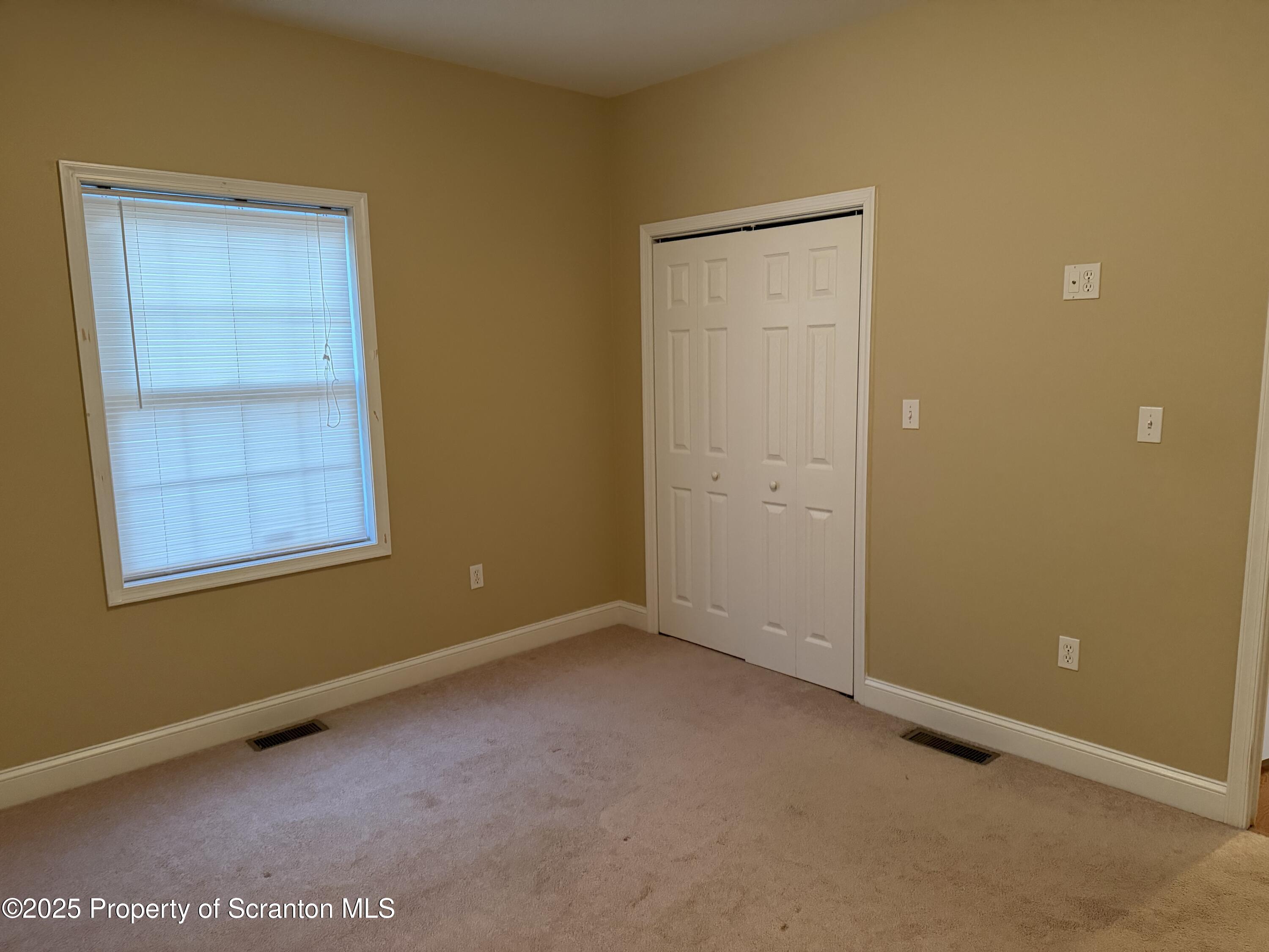 617 Arthur Avenue Scranton, PA 18510 - Photo 12 of 15 an empty room with windows and closet
