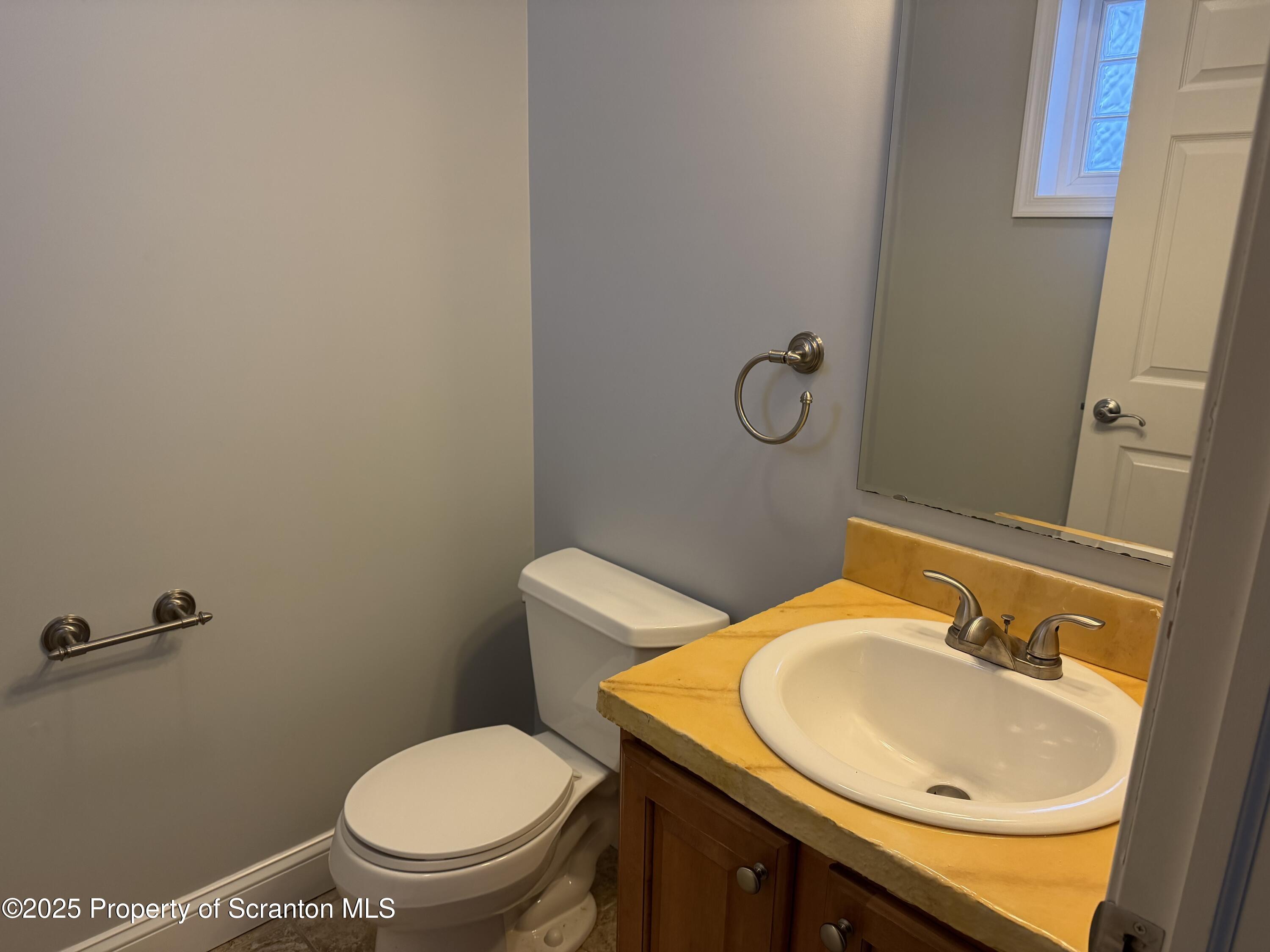 617 Arthur Avenue Scranton, PA 18510 - Photo 13 of 15 a bathroom with a sink a toilet and mirror