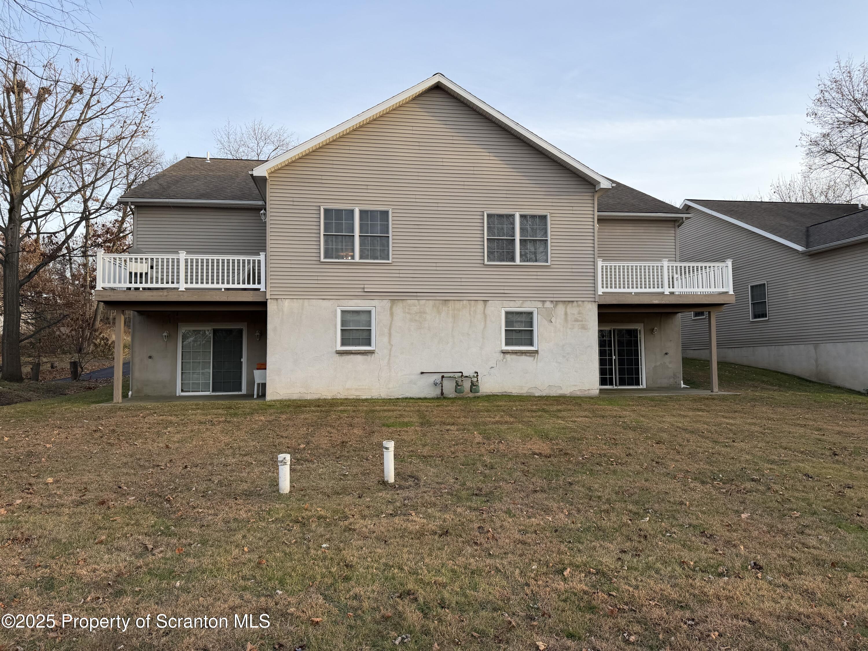 617 Arthur Avenue Scranton, PA 18510 - Photo 15 of 15 a front view of a house with a yard and garage