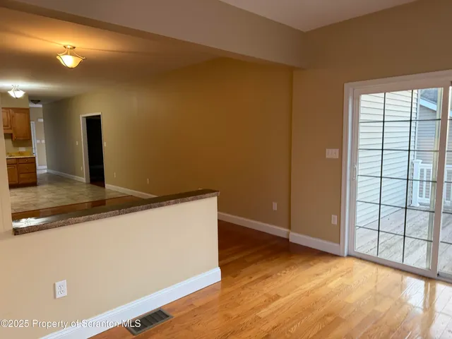 a view of a livingroom with wooden floor