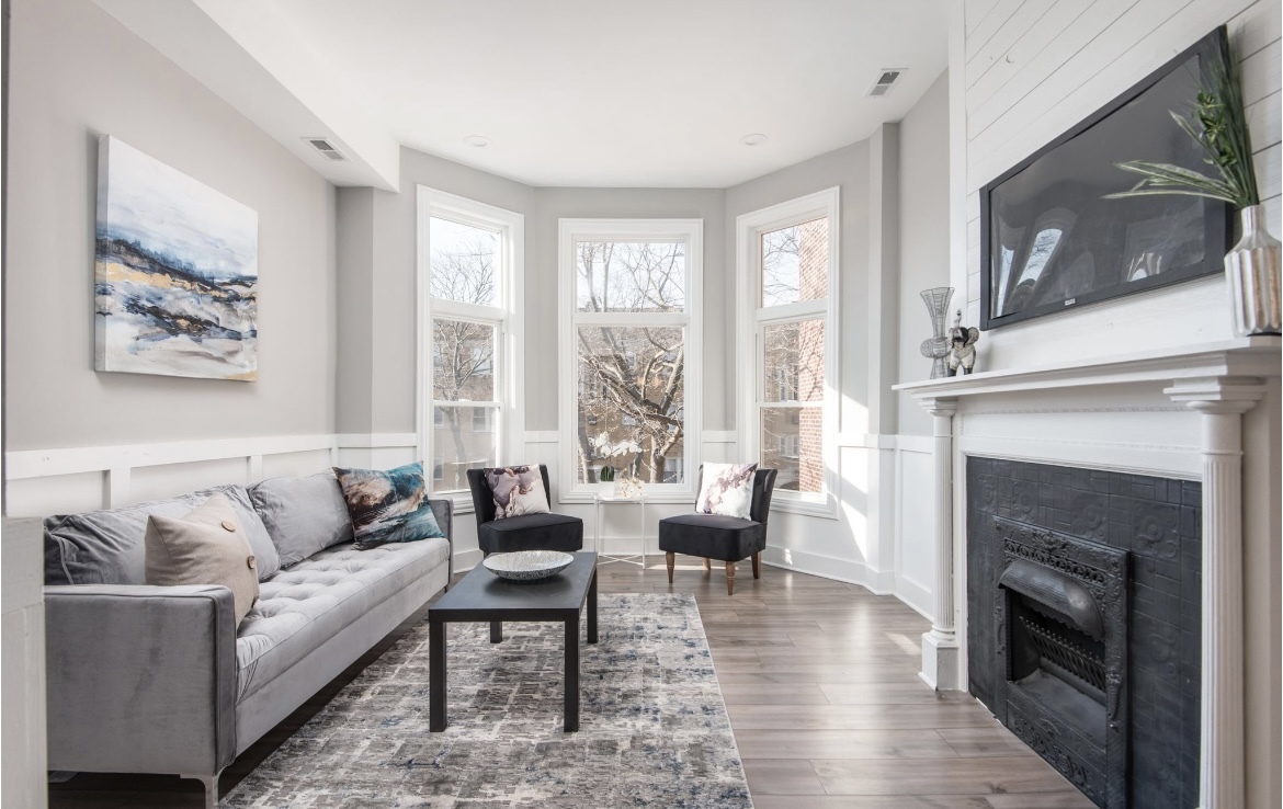 6607 South Ingleside Avenue Chicago, IL 60637 - Photo 12 of 28 a living room with furniture large window and a fireplace
