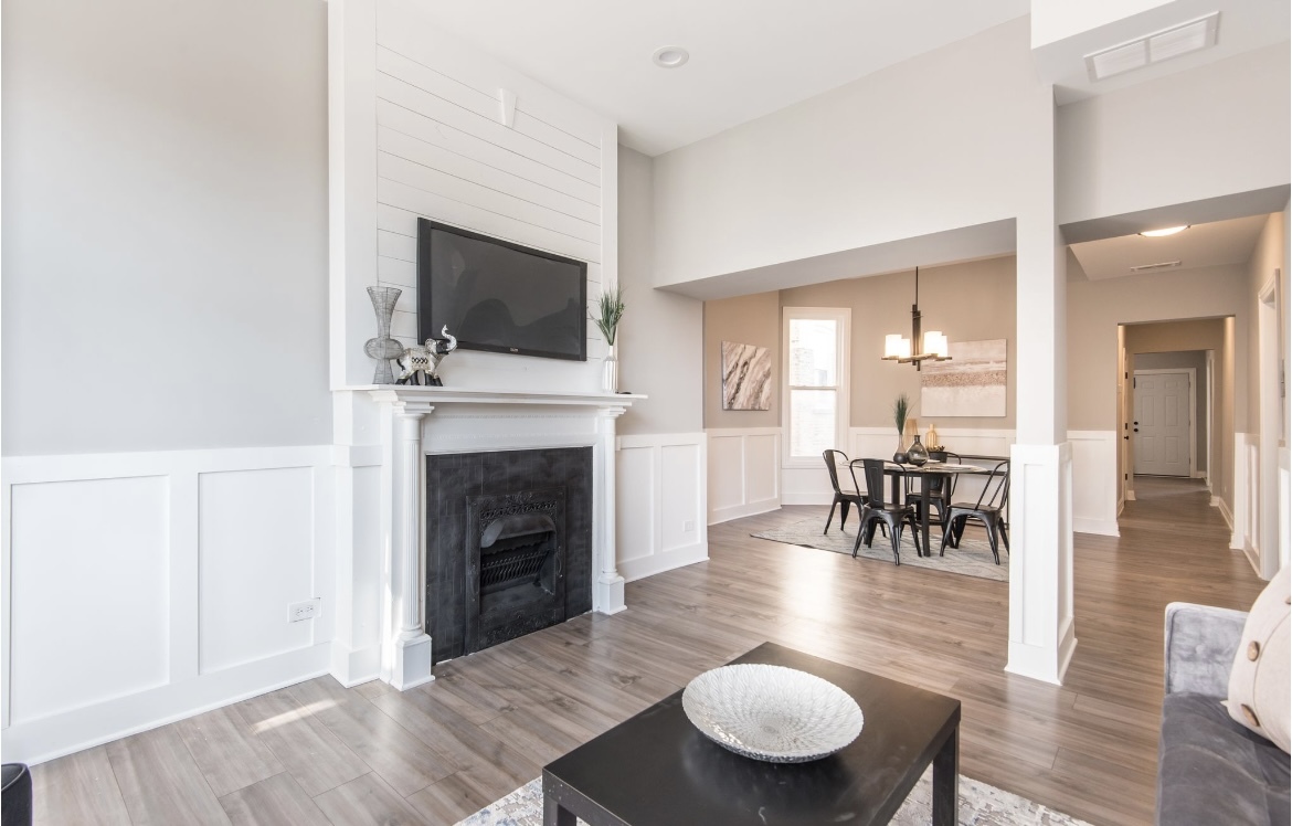 6607 South Ingleside Avenue Chicago, IL 60637 - Photo 13 of 28 a living room with furniture a fireplace and a flat screen tv
