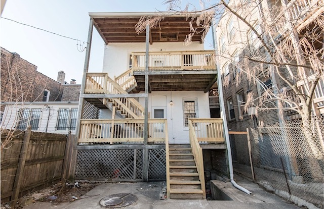 6607 South Ingleside Avenue Chicago, IL 60637 - Photo 27 of 28 a front view of a house with iron stairs