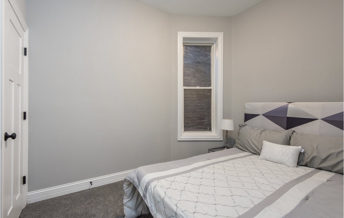 6607 South Ingleside Avenue Chicago, IL 60637 - Photo 8 of 28 a bedroom with a bed and a window