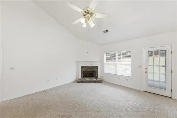 a view of a livingroom with a chandelier fan