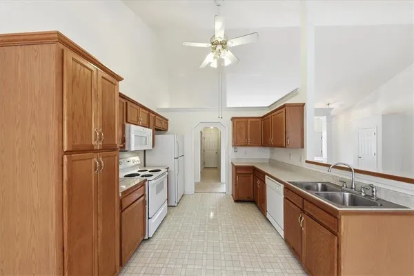 a kitchen with refrigerator a microwave a stove and a refrigerator