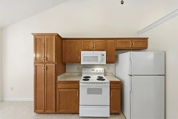 a kitchen with a sink cabinets and window